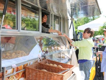 Women purchasing food from a food truck